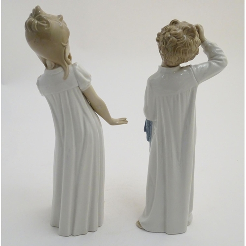 89 - Two Nao bedtime figures to include Yawning Girl, model no. 230, and Boy with Slippers, model no. 232... 