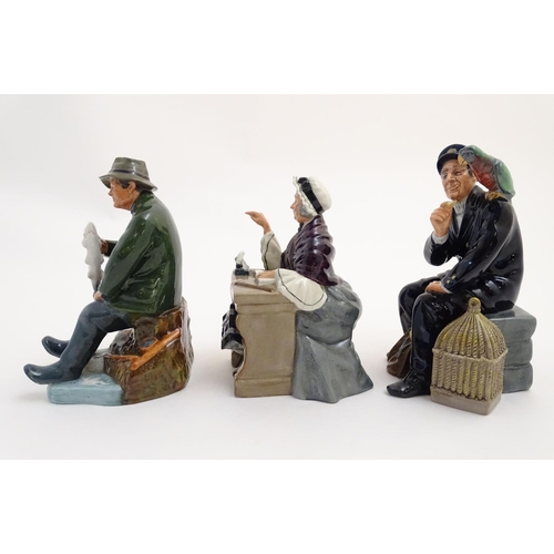 92 - Three Royal Doulton seated figures, comprising Shore Leave, a seaman feeding a parrot, model no. 225... 