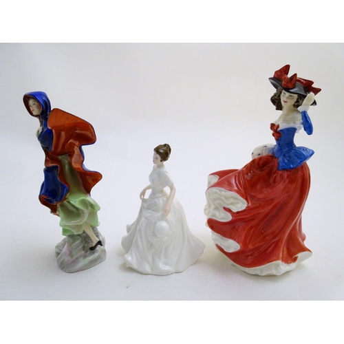 93 - Three Royal Doulton figurines depicting women, Janet, model no. 4042, May, model no. 2746, and Harmo... 