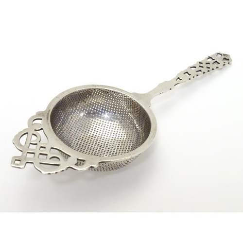 178 - A silver tea strainer hallmarked Birmingham 1930 maker Hammond, Turner & Sons 6 1/2