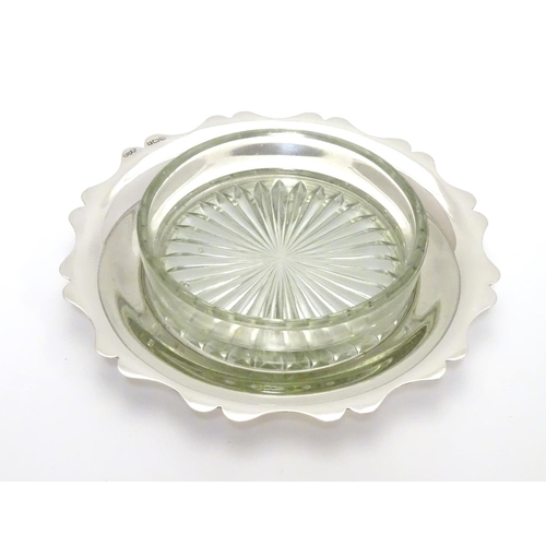 179 - A silver and cut glass butter dish. Hallmarked Birmingham 1946 maker EJ Houlston. Approx. 5 ½” diame... 