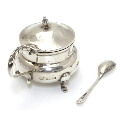 188 - A silver mustard pot with blue glass liner hallmarked Sheffield 1912 maker John Round & Son Ltd (Jos... 