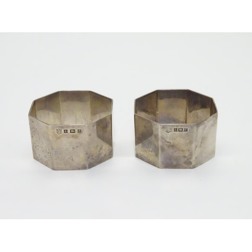 191 - A pair of silver napkin rings of octagonal form. Hallmarked Birmingham 1954 maker Barker Brothers Si... 