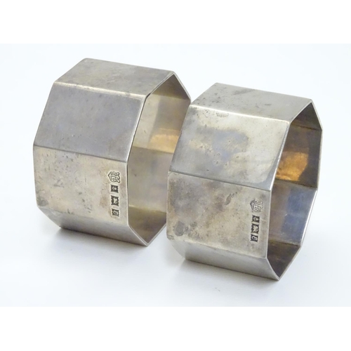 191 - A pair of silver napkin rings of octagonal form. Hallmarked Birmingham 1954 maker Barker Brothers Si... 