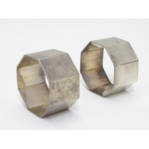 191 - A pair of silver napkin rings of octagonal form. Hallmarked Birmingham 1954 maker Barker Brothers Si... 