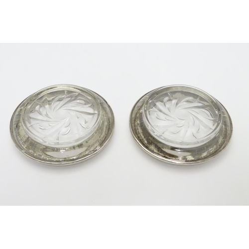 199 - Pair of sterling silver mounted glass coasters bearing the maker’s mark for Amston Silver Co. of Mer... 