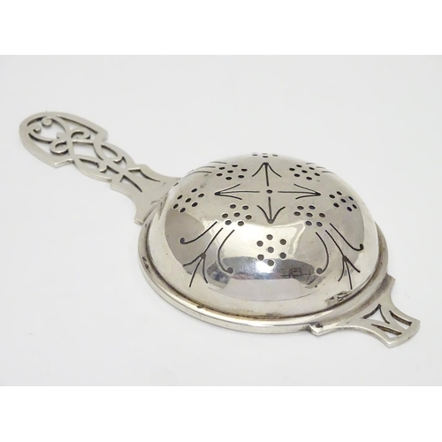 218 - A silver tea strainer hallmarked Sheffield 1965 maker HH. 5