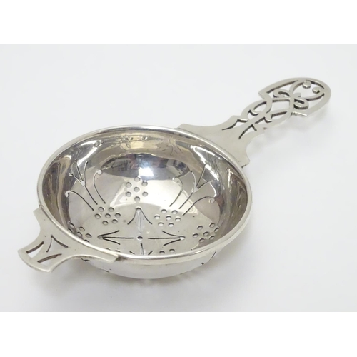 218 - A silver tea strainer hallmarked Sheffield 1965 maker HH. 5