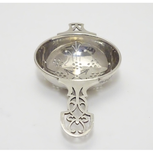 218 - A silver tea strainer hallmarked Sheffield 1965 maker HH. 5