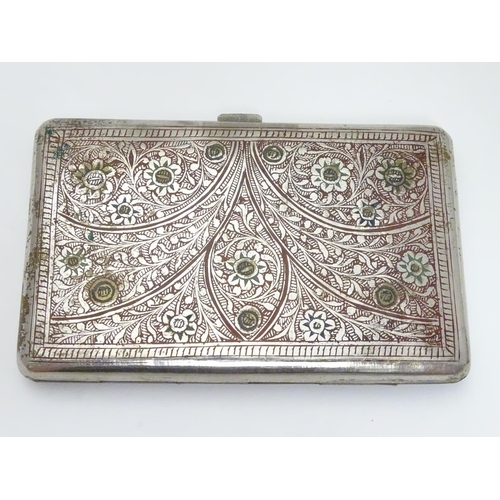 222 - A white metal cigarette case, the eastern/ Islamic style decoration having red and green enamel styl... 