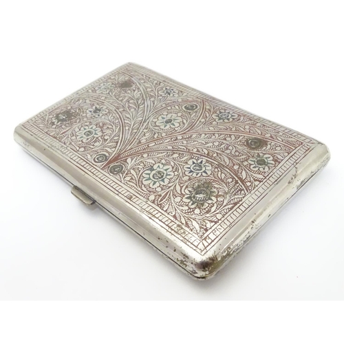 222 - A white metal cigarette case, the eastern/ Islamic style decoration having red and green enamel styl... 