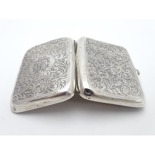 233 - A silver cigarette case of shaped form with engraved acanthus scroll decoration. Hallmarked Birmingh... 