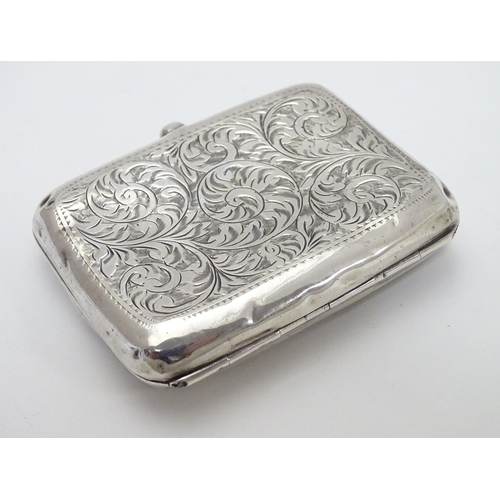 233 - A silver cigarette case of shaped form with engraved acanthus scroll decoration. Hallmarked Birmingh... 