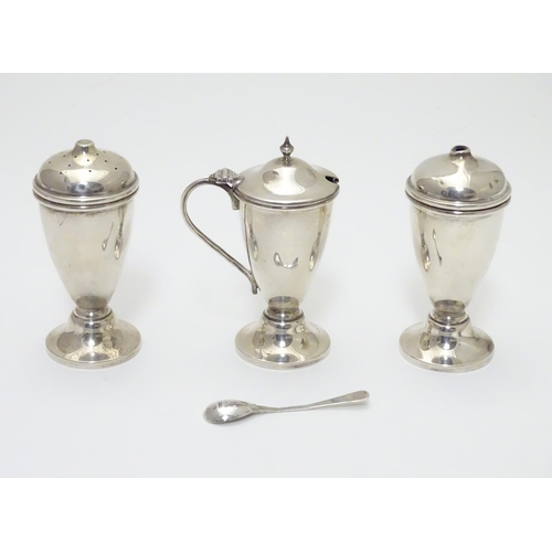 237 - An Art Deco silver three piece cruet set comprising salt, pepper and mustard pot (with spoon and fac... 