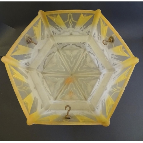 145 - An Art Deco glass pendant lampshade, of stepped, hexagonal form with etched cloudburst decoration an... 