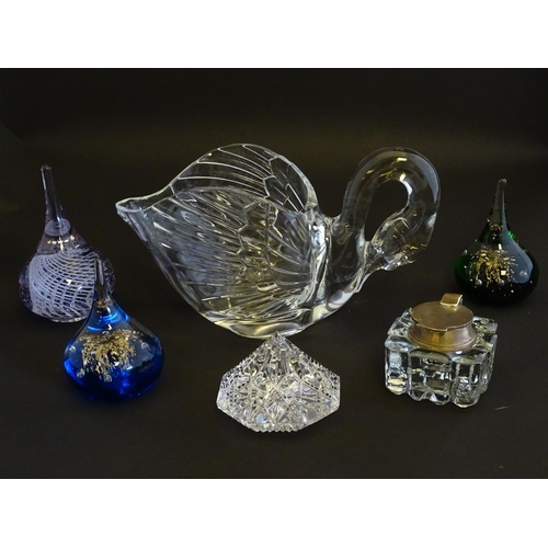 154 - An assortment of glass items, comprising a table formed as a preening swan, three art glass paperwei... 