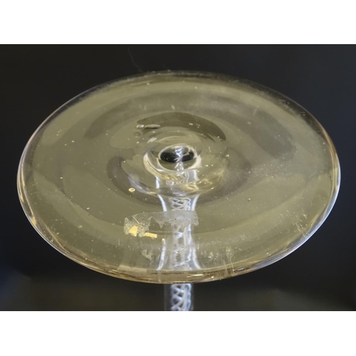 167 - An early 19thC novelty wine glass, with oversized air twist inclusions of four spirals, the cup with... 