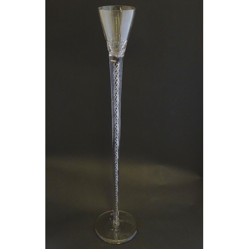 167 - An early 19thC novelty wine glass, with oversized air twist inclusions of four spirals, the cup with... 