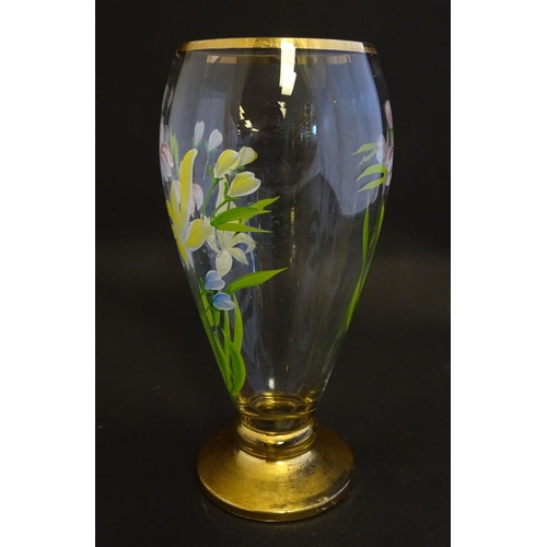 168 - An early 20thC clear glass vase, with gilt base and rim, decorated with polychrome enamelled lilies.... 