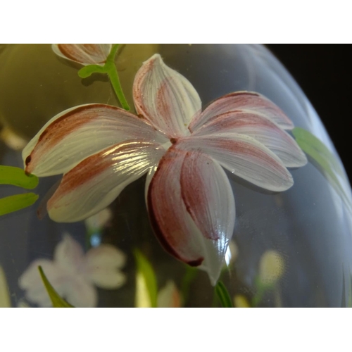 168 - An early 20thC clear glass vase, with gilt base and rim, decorated with polychrome enamelled lilies.... 