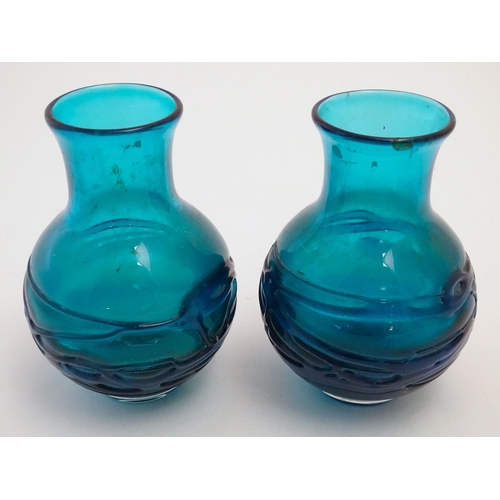 169 - An early to mid 20thC pair of turquoise art glass  vases in the manner of Whitefriars, each decorate... 