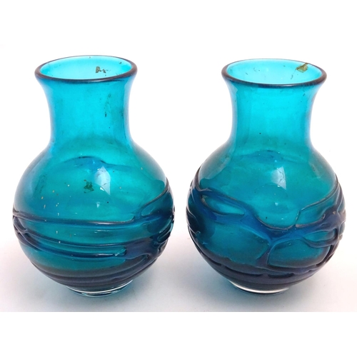 169 - An early to mid 20thC pair of turquoise art glass  vases in the manner of Whitefriars, each decorate... 