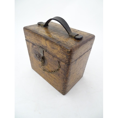 96 - Pigeon Racing : a Toulet 10 bird racing pigeon Clock with oak case , brass fittings and leather carr... 