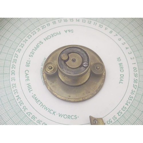 96 - Pigeon Racing : a Toulet 10 bird racing pigeon Clock with oak case , brass fittings and leather carr... 