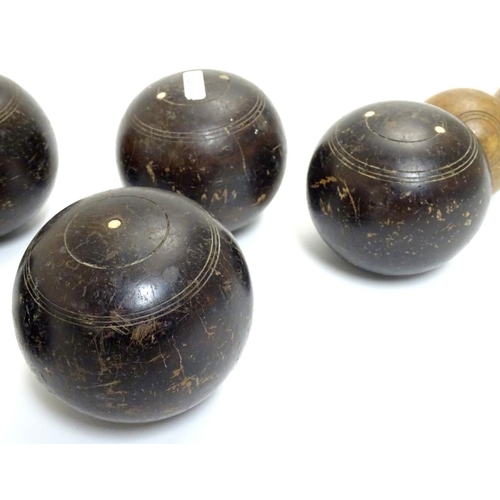 97 - Seven early 20thC lignum vitae bowls, each approximately 4 1/2'' in diameter. Together with two hard... 