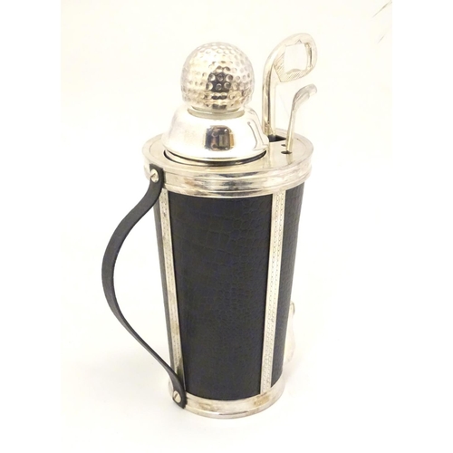 229 - A novelty cocktail shaker formed as a golf bag with stirrers etc formed as golf clubs. 11'' high
