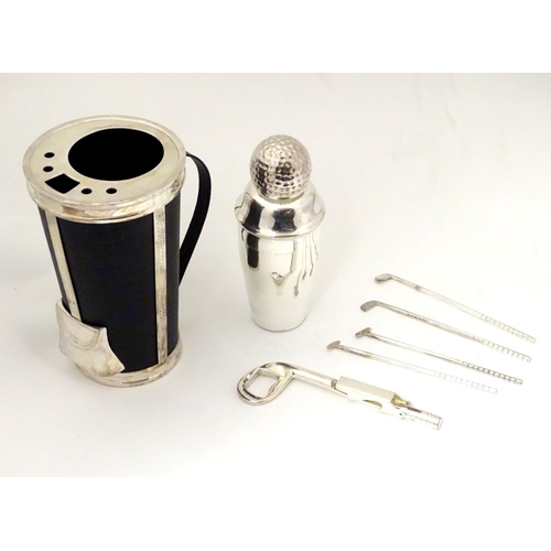 229 - A novelty cocktail shaker formed as a golf bag with stirrers etc formed as golf clubs. 11'' high