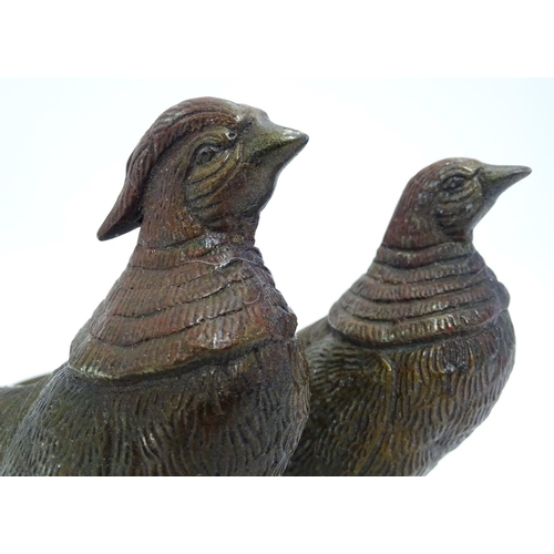 296 - A pair of cast menu holders formed as Lady Amherst pheasants. Largest approx. 11