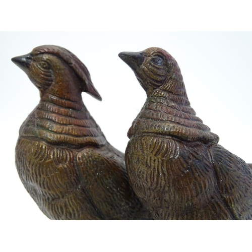 296 - A pair of cast menu holders formed as Lady Amherst pheasants. Largest approx. 11