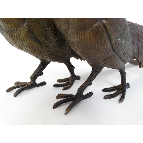 296 - A pair of cast menu holders formed as Lady Amherst pheasants. Largest approx. 11