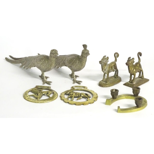 304 - A quantity of assorted brass items, to include two naive folk art cows on bases, two horse brasses a... 