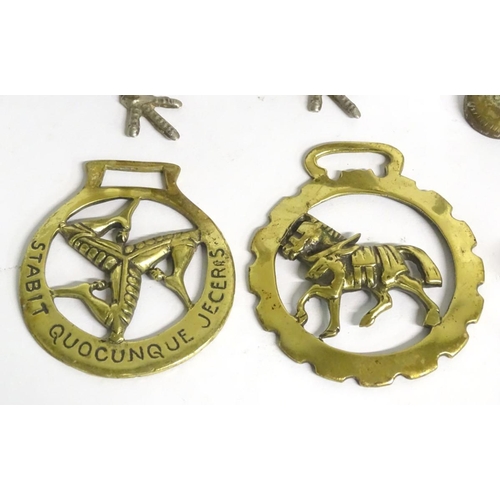304 - A quantity of assorted brass items, to include two naive folk art cows on bases, two horse brasses a... 
