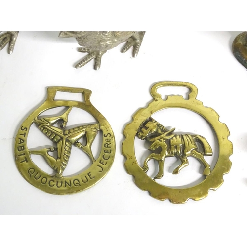304 - A quantity of assorted brass items, to include two naive folk art cows on bases, two horse brasses a... 
