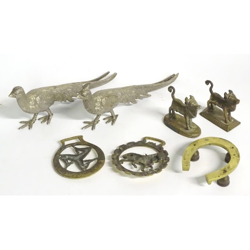 304 - A quantity of assorted brass items, to include two naive folk art cows on bases, two horse brasses a... 