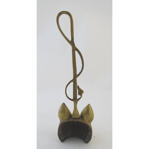 405 - A Victorian cast brass figural doorstop/door porter, hunting themed, formed as a fox mask surmounted... 