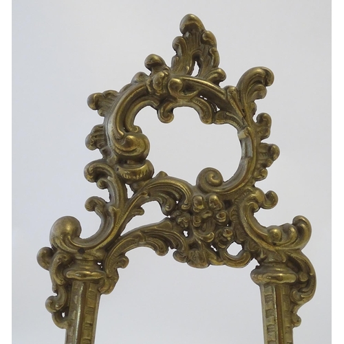 858 - A 20thC cast brass table top easel with scrolling foliate decoration. Approx. 15 1/2