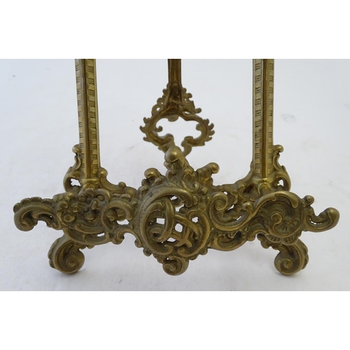 858 - A 20thC cast brass table top easel with scrolling foliate decoration. Approx. 15 1/2