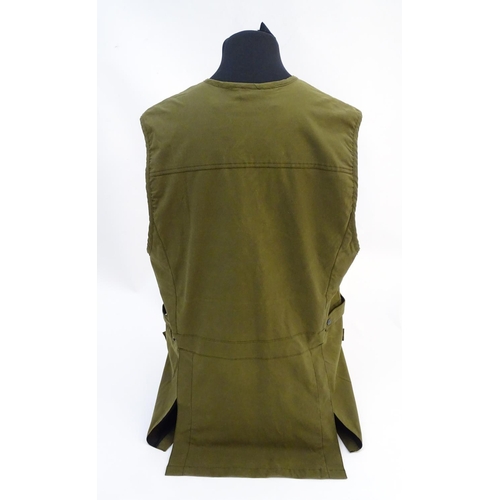 315 - A Laksen olive green skeet vest, size 3XL