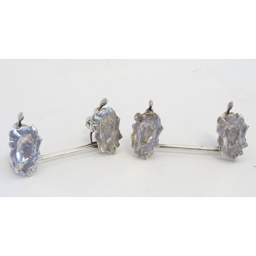 221 - A pair of silver plate knife rests with horse and fence decoration 3 1/2