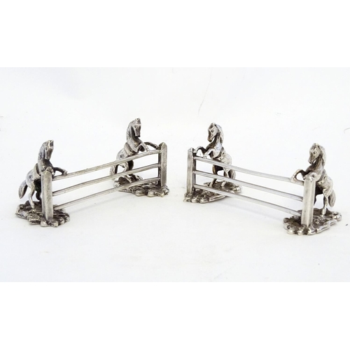 221 - A pair of silver plate knife rests with horse and fence decoration 3 1/2