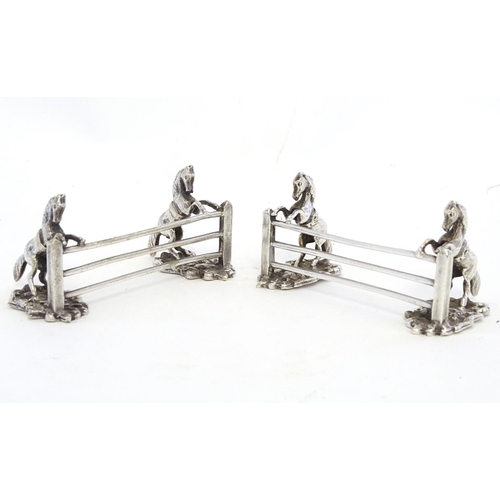 221 - A pair of silver plate knife rests with horse and fence decoration 3 1/2