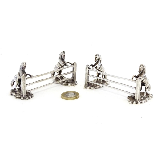 221 - A pair of silver plate knife rests with horse and fence decoration 3 1/2