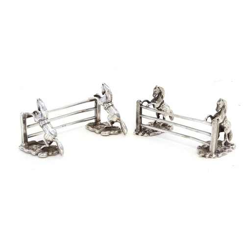 221 - A pair of silver plate knife rests with horse and fence decoration 3 1/2