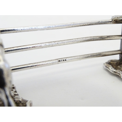 221 - A pair of silver plate knife rests with horse and fence decoration 3 1/2