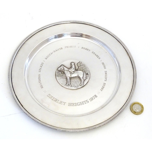 222 - A silver salver / trophy plate with horse and jockey medallion to centre  engraved Shirley Heights 1... 
