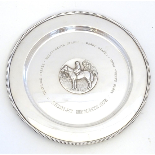 222 - A silver salver / trophy plate with horse and jockey medallion to centre  engraved Shirley Heights 1... 